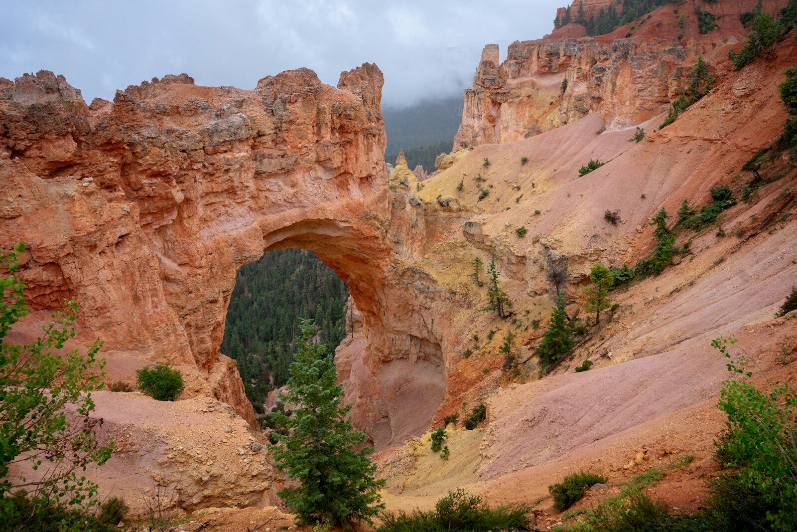 Photo by Bob Brewer a large rock formation with a hole in the middle of it